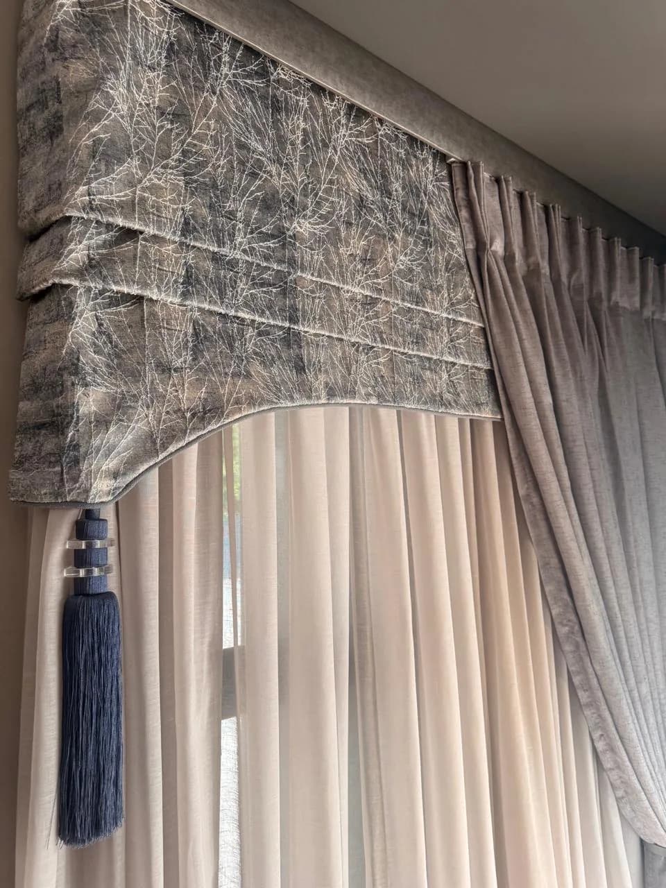 Layered curtains with a shaped pelmet and decorative tassel at the Bloem Project Funeral Parlour