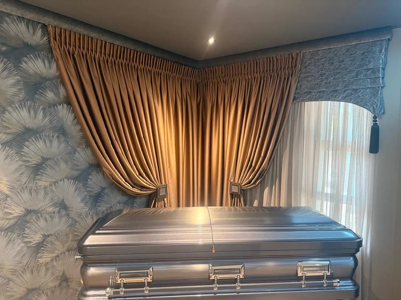 Bloem Project Funeral Parlour viewing room with bronze curtains, decorative headings, a shaped pelmet and patterned wallpaper