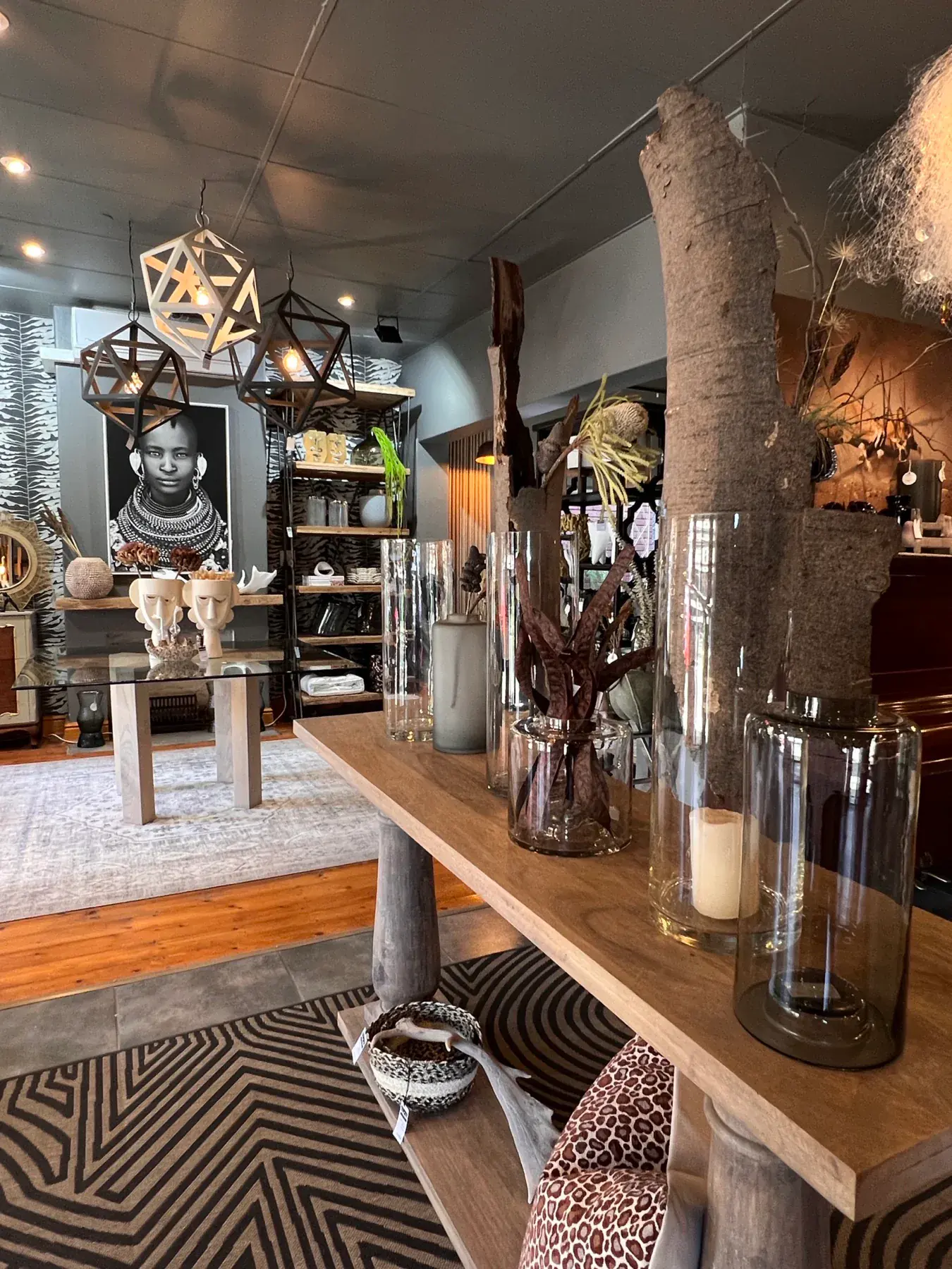 Decor display with vases, furniture and lighting.