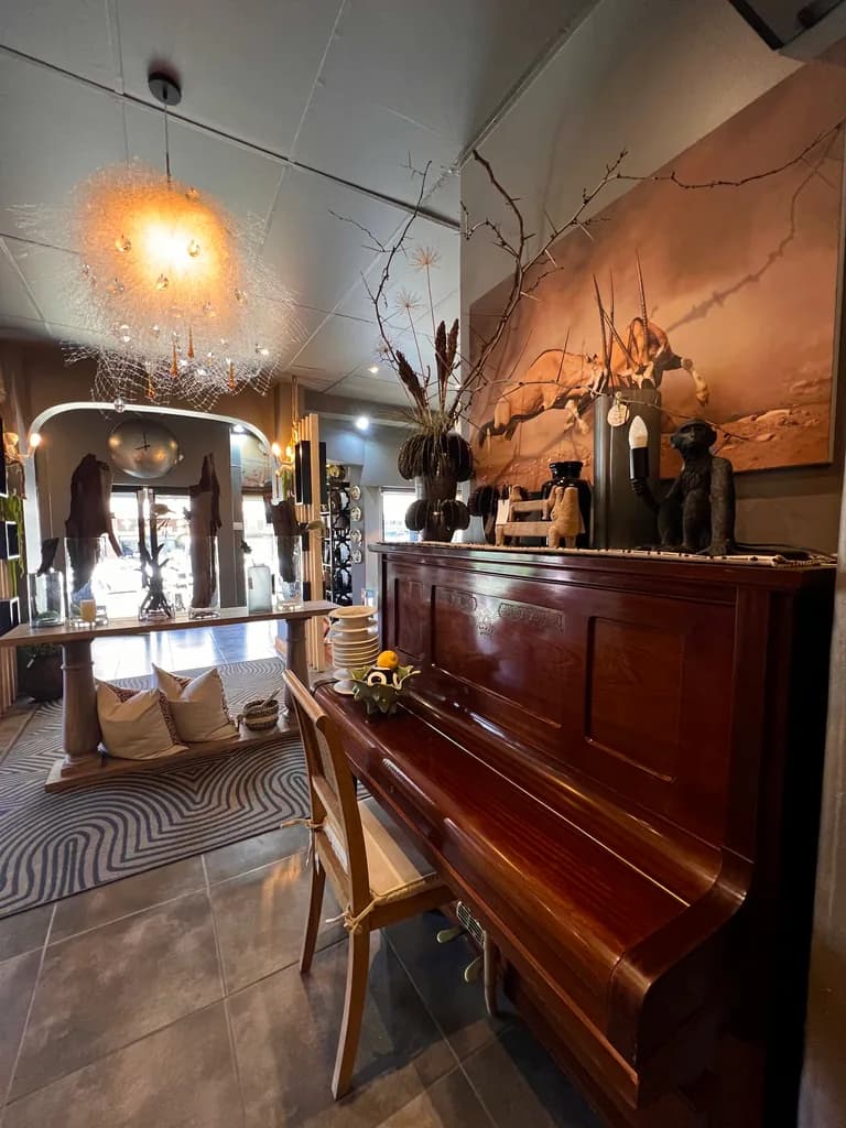 Piano, lighting, rug and decor inside the showroom.