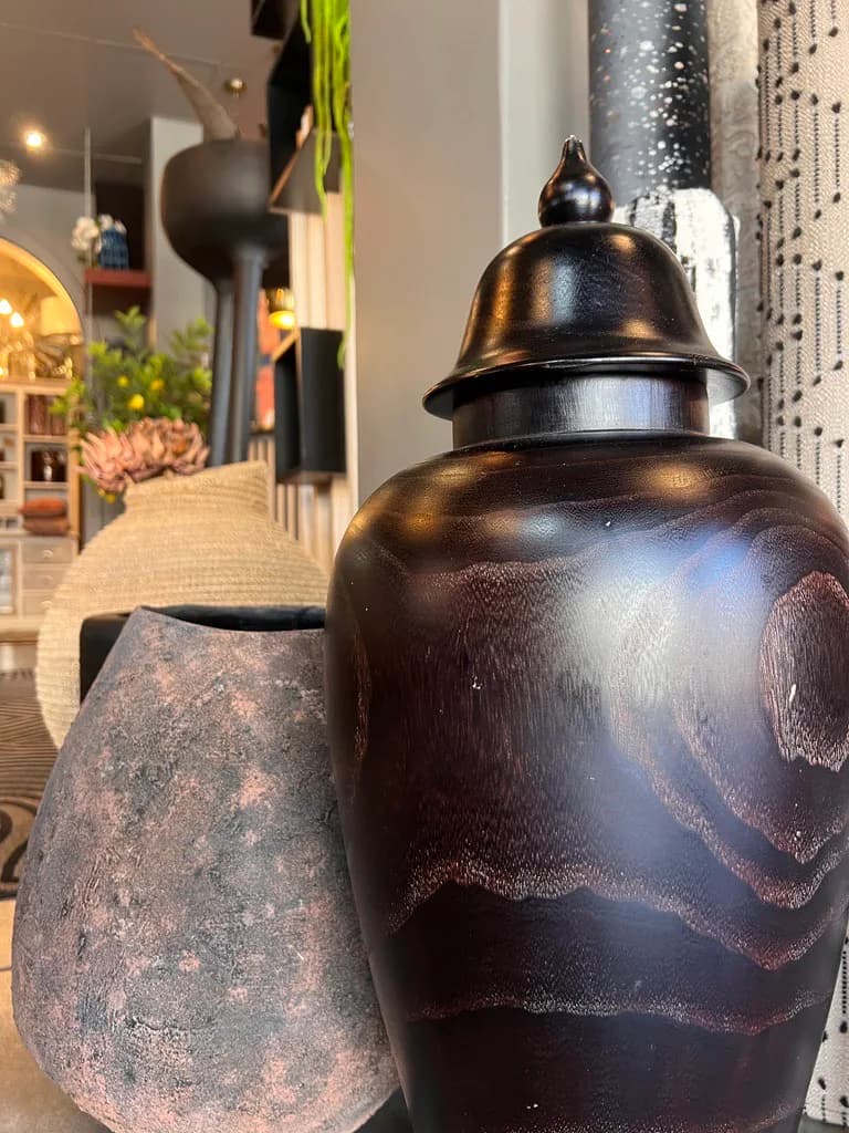 Decorative vases and cushions displayed inside the showroom.