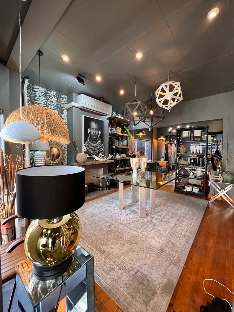 Lighting, mirrors, rugs and decor pieces inside the showroom.