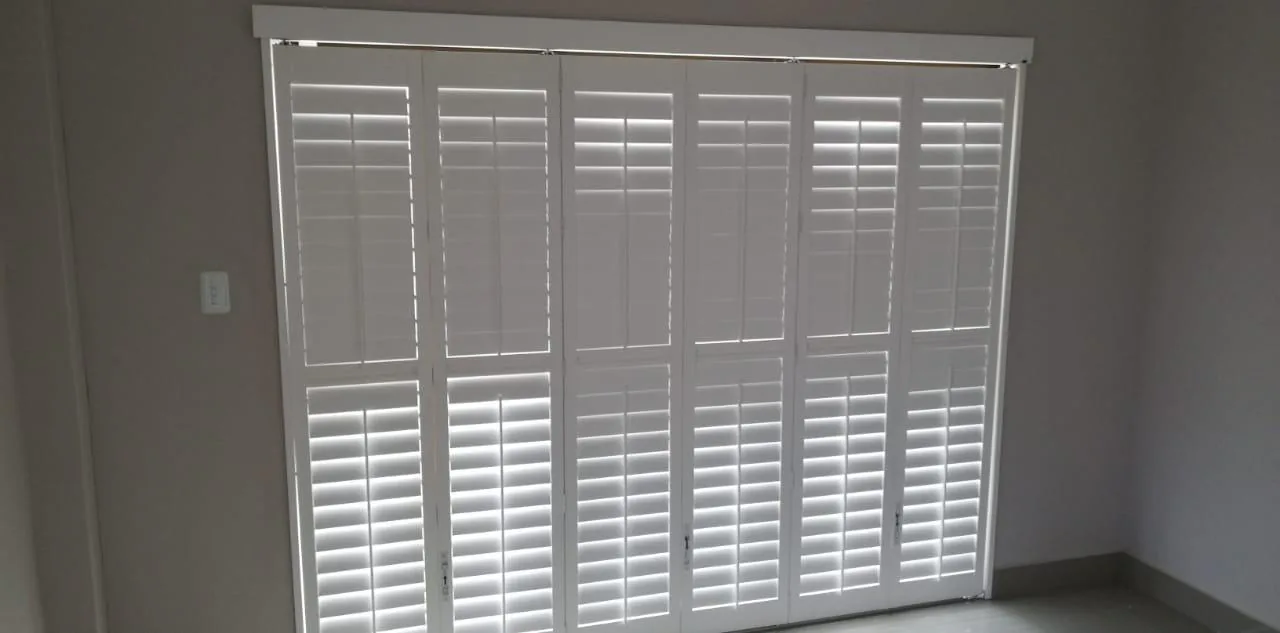 Shutters: Fitted shutters for structured light control, privacy and a clean architectural window finish.