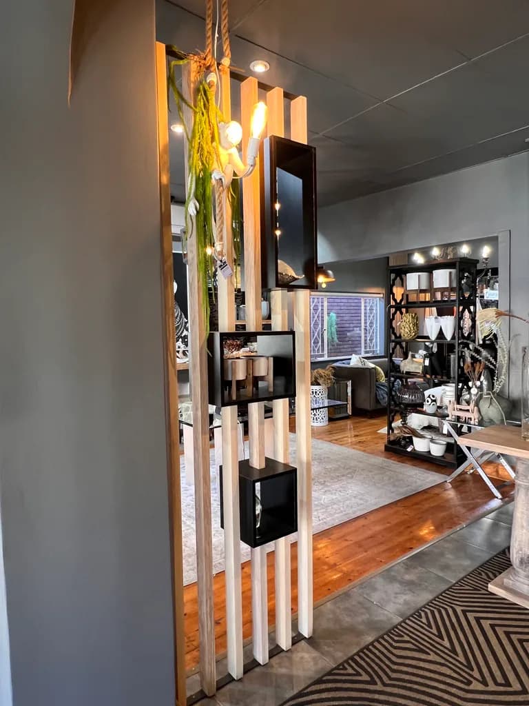Showroom entrance detail with light feature and decor shelving.