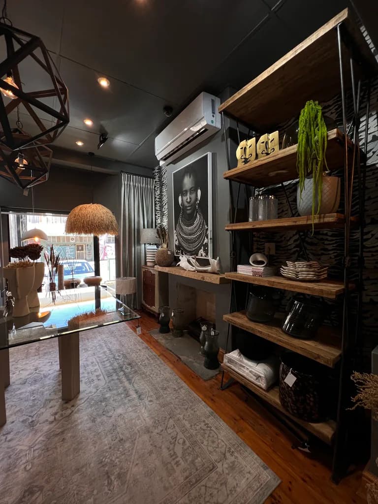 Free State Curtain Parlour showroom with shelving, lighting, rug and decor displays.