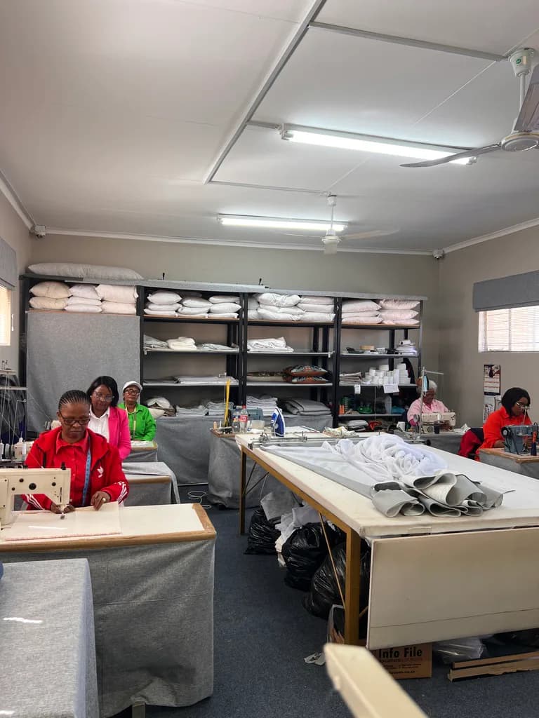 Free State Curtain Parlour workshop with sewing stations, cutting tables and fabric storage.
