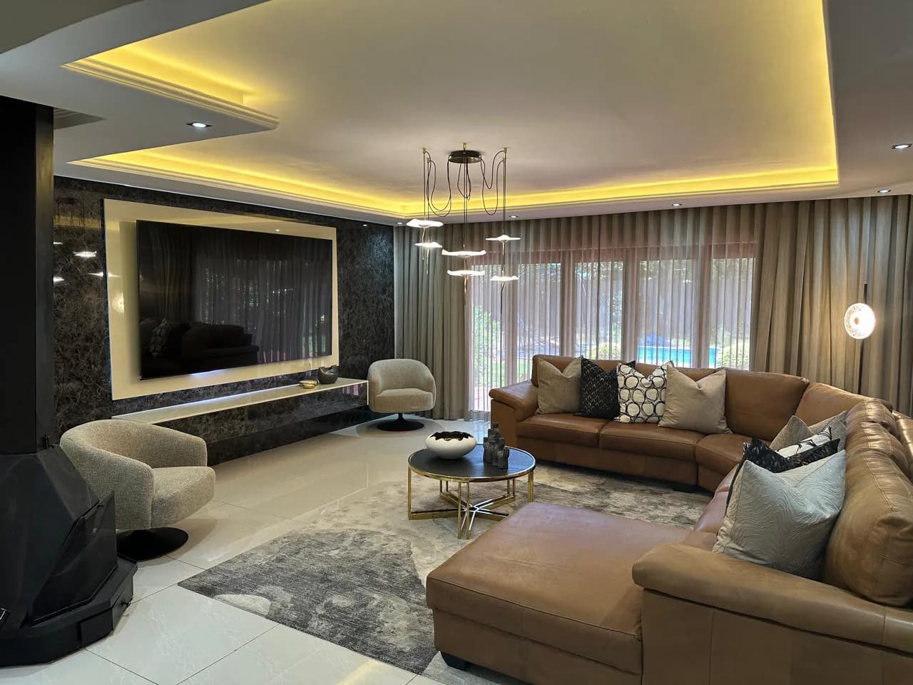 Rugs, lighting & decor: Choose rugs, lamps, LED touches, mirrors and decor pieces as the final layers that bring the room together.